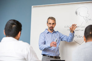 Professor at whiteboard