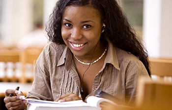 student in library