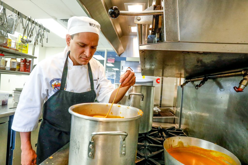 Culinary Arts student stirring soup